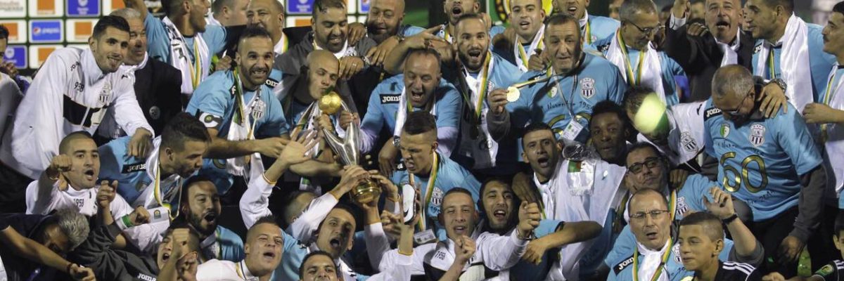 Entente Sportive de Setif of Algeria celebrate with the trophy after winning the African Champions League final soccer match against AS Vita Club of Democratic Republic of the Congo, at Mustapha Tchaker stadium in Blida November 1, 2014. Entente Setif won the African Champions League title for the first time in 26 years after beating AS Vita Club on away goals following a 3-3 aggregate draw on Saturday. REUTERS/Louafi Larbi (ALGERIA - Tags: SPORT SOCCER)